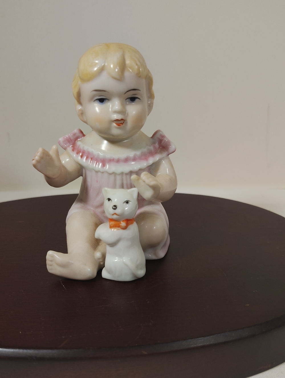 Porcelain Baby Figurine in Pink Outfit with White Cat